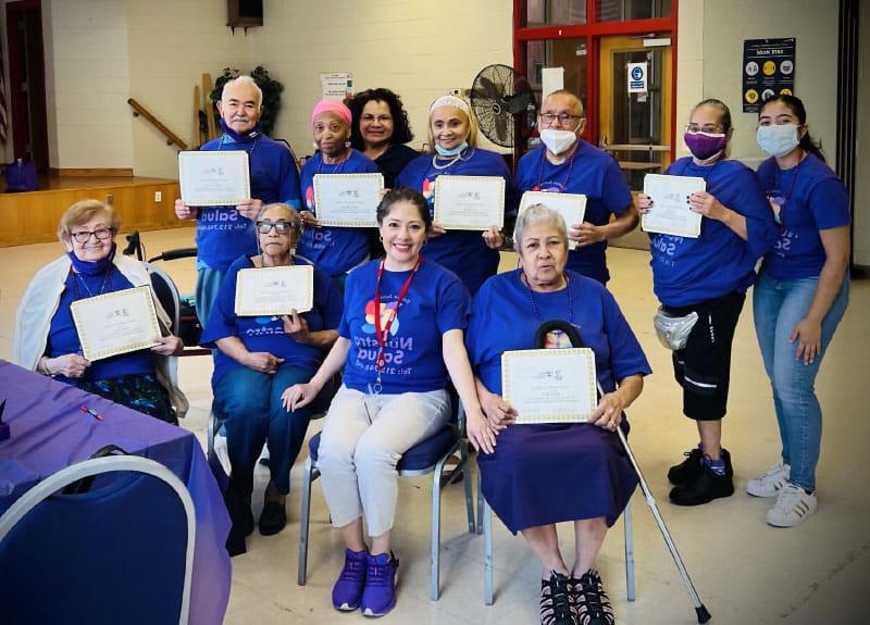 Adriana Pérez (center) with graduating members of the Tiempo Juntos study. (Photo courtesy of Adriana Pérez)